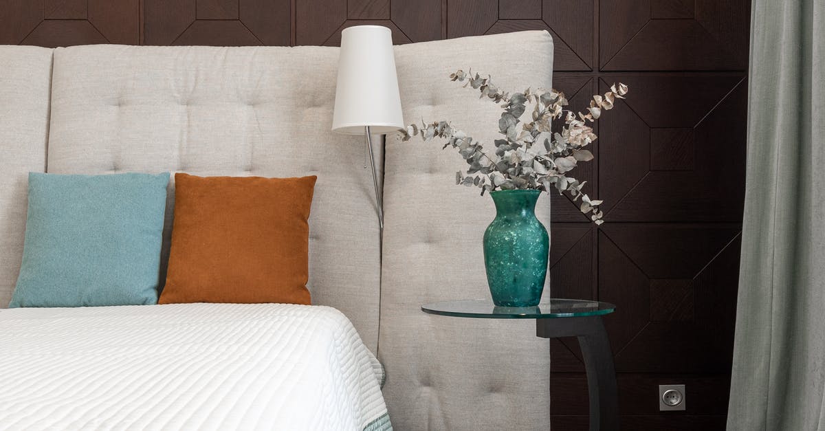 Difference between residence permit and common format residence permit - Bed with cushions near flowers Difference between residence permit and common format residence permit - Bed with cushions near flowers