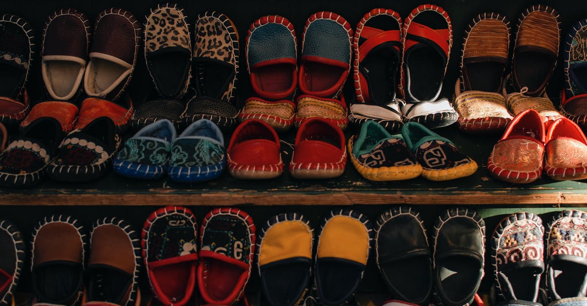 different arrival date in turkey than visa is for - Shelves with assorted small bright handmade Turkish boots for kids selling in small local workshop different arrival date in turkey than visa is for - Shelves with assorted small bright handmade Turkish boots for kids selling in small local workshop