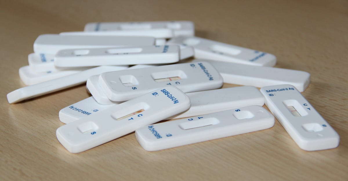 Do airlines still use the same info as on the IATA website during the COVID-19 pandemic, or do they have access to more up-to-date, exhaustive info? - Close-up of Covid-19 Test Kits