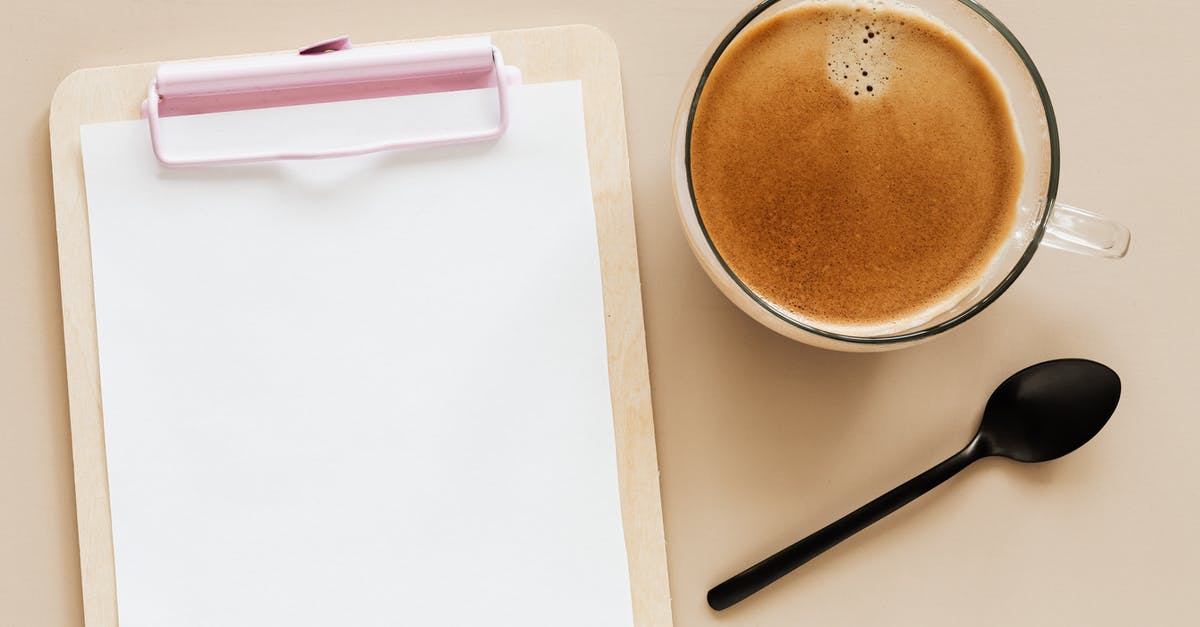 Do Alitalia serve breakfast on an early, short-haul flight? - Delicious hot coffee and clipboard on beige surface Do Alitalia serve breakfast on an early, short-haul flight? - Delicious hot coffee and clipboard on beige surface