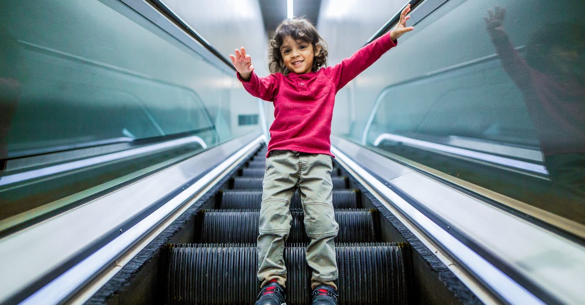 Do any airlines have bans on children from certain passenger sections? - Positive boy standing on escalator Do any airlines have bans on children from certain passenger sections? - Positive boy standing on escalator