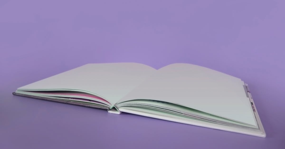 Do blank passport pages have to be consecutive? - Opened Book on Purple Surface Do blank passport pages have to be consecutive? - Opened Book on Purple Surface