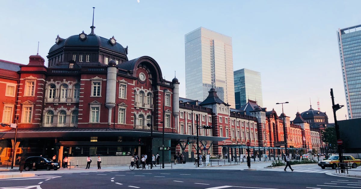 Do bus stations have names in Latin letters in Tokyo - People Walking on Pedestrian Lane Near High Rise Buildings Do bus stations have names in Latin letters in Tokyo - People Walking on Pedestrian Lane Near High Rise Buildings