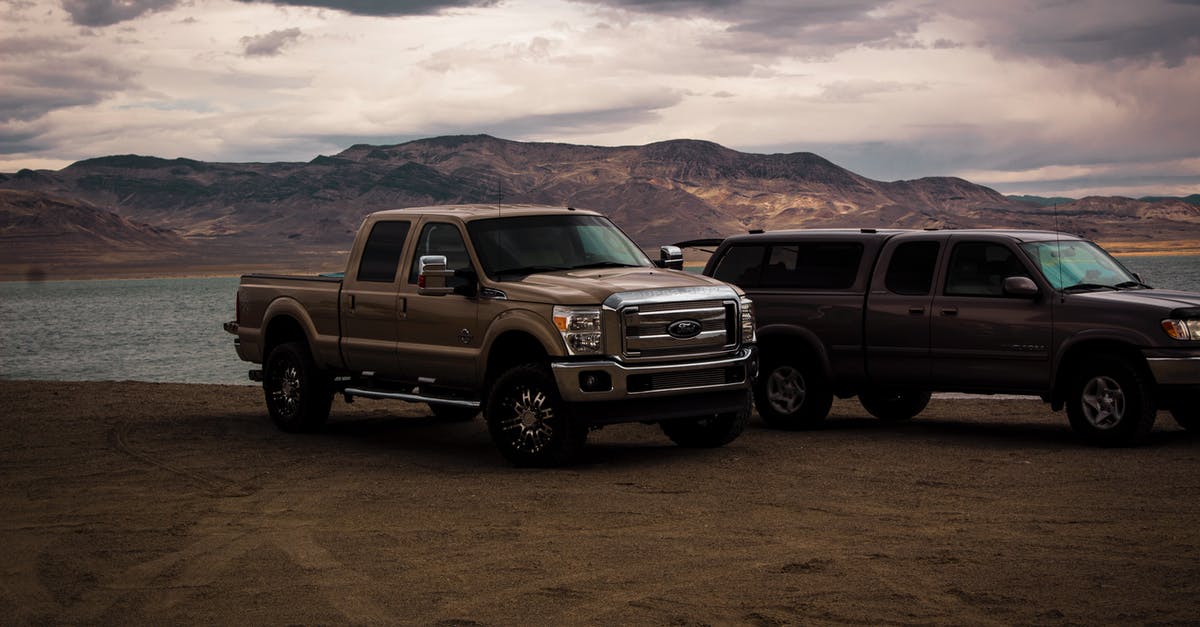 Do car hire companies in the USA generally allow you to pick up cars after hours? - Photography of Vehicles Near Lake Do car hire companies in the USA generally allow you to pick up cars after hours? - Photography of Vehicles Near Lake