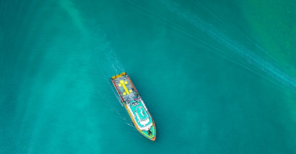 Do cruise passengers answer In Transit on the ESTA application? - Aerial view of contemporary industrial boat floating along turquoise rippling ocean on clear day Do cruise passengers answer In Transit on the ESTA application? - Aerial view of contemporary industrial boat floating along turquoise rippling ocean on clear day