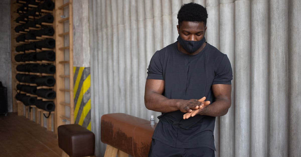 Do EU Refund rules apply to Coronavirus related cancellations by airlines? - Black man rubbing palms after applying antiseptic Do EU Refund rules apply to Coronavirus related cancellations by airlines? - Black man rubbing palms after applying antiseptic