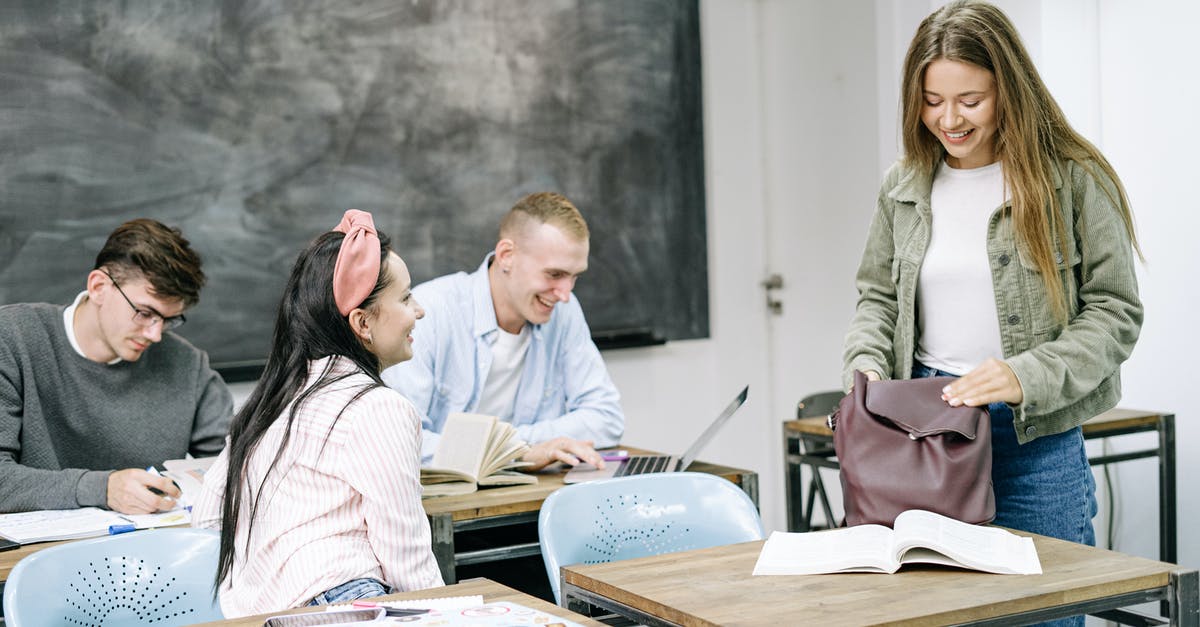 Do F-1 students need a visa to visit Paris and Amsterdam during layovers? [duplicate] - Man and Woman Sitting on Chair