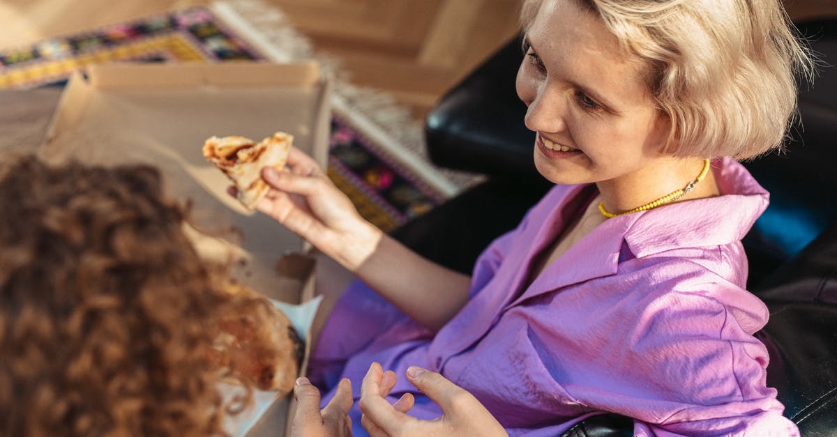 Do home deliveries of food in the USA have "anti-tampering stickers" on them? [closed] - Woman in Purple Button Up Shirt Holding Brown Bread