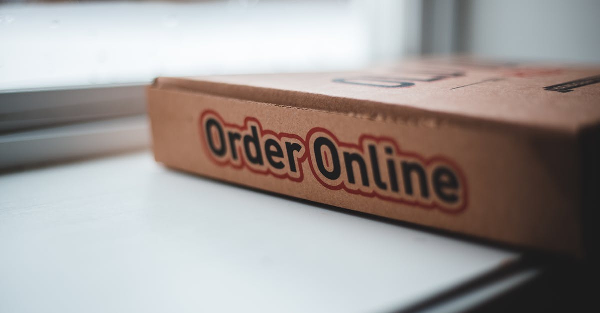 Do home deliveries of food in the USA have "anti-tampering stickers" on them? [closed] - Soft focus of cardboard box of delivery pizza online service placed on white windowsill in daylight