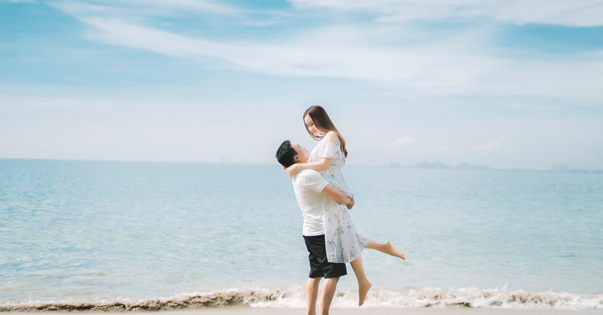 Do I have problem if my travel date is just 9 days after my visa appointment? - Happy couple enjoying vacation together on seashore Do I have problem if my travel date is just 9 days after my visa appointment? - Happy couple enjoying vacation together on seashore