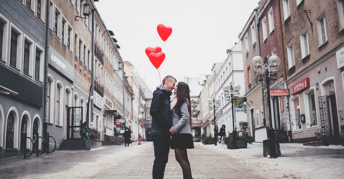 Do I have problem if my travel date is just 9 days after my visa appointment? - Couple Walking on City Street Do I have problem if my travel date is just 9 days after my visa appointment? - Couple Walking on City Street