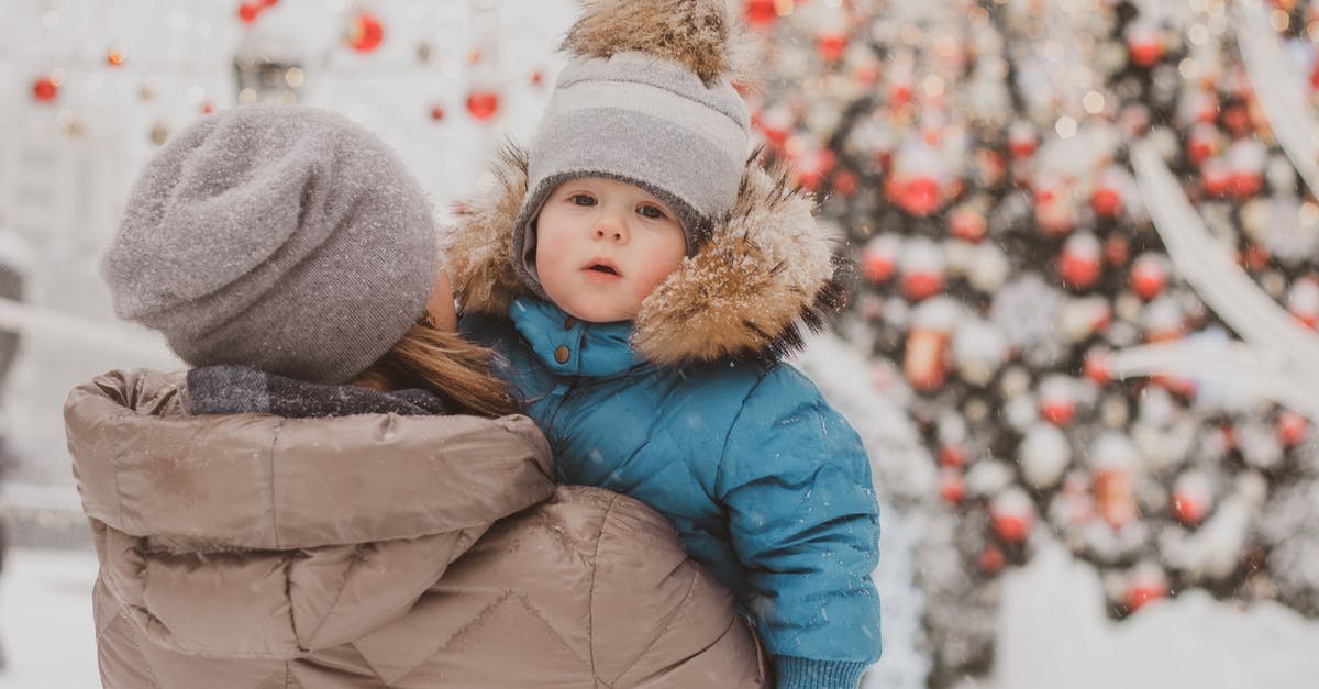 Do I have to carry snow chains in Europe? - A Mother Carrying Her Daughter Out in the Snow Do I have to carry snow chains in Europe? - A Mother Carrying Her Daughter Out in the Snow