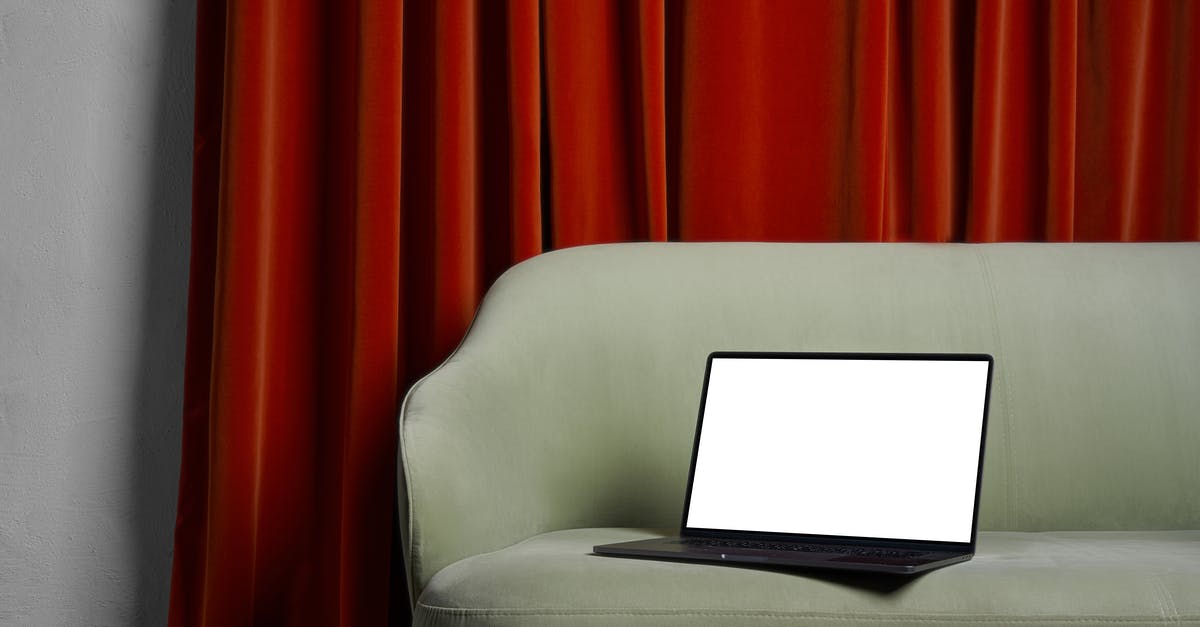 Do I have to declare my new laptop when leaving? - Laptop on couch near red curtains and wall Do I have to declare my new laptop when leaving? - Laptop on couch near red curtains and wall
