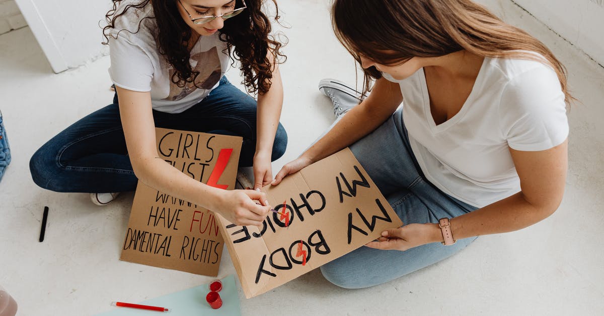 Do I have to go through customs, recheck my bag, etc. during my Heathrow layover? - Woman in White Shirt Holding Brown Wooden Board Do I have to go through customs, recheck my bag, etc. during my Heathrow layover? - Woman in White Shirt Holding Brown Wooden Board