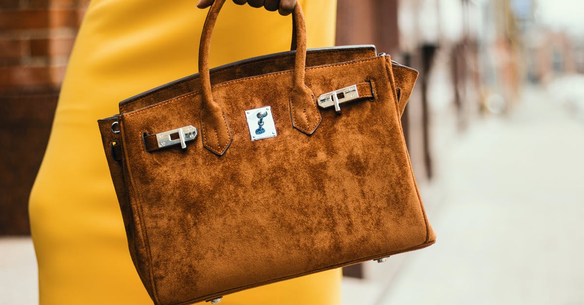 Do I have to handle my bags when transiting in Istanbul? - Woman Wearing Brown Leather Tote Bag Do I have to handle my bags when transiting in Istanbul? - Woman Wearing Brown Leather Tote Bag