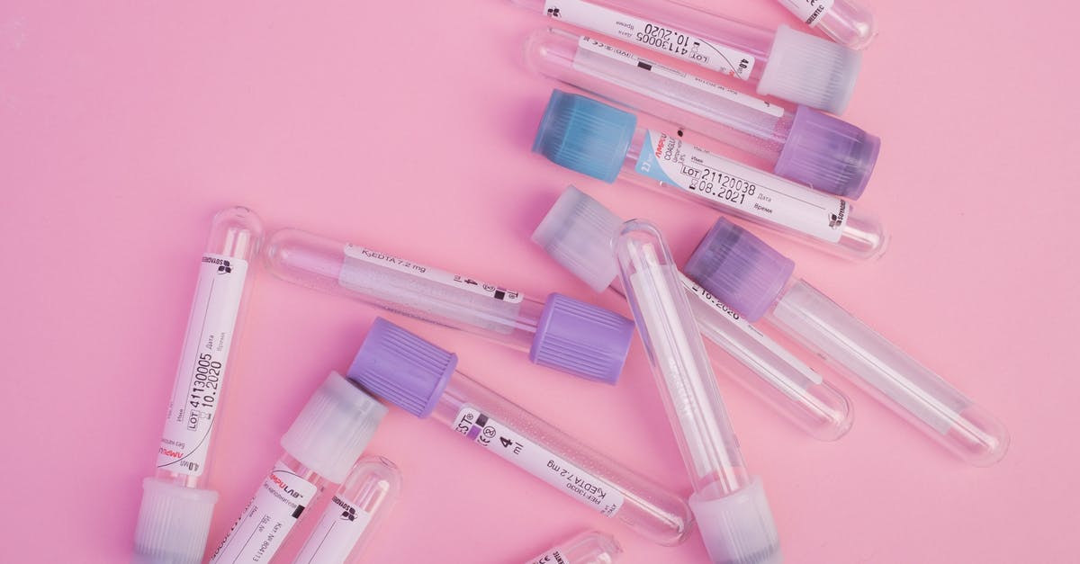Do I need a negative COVID 72 hours before departure starting from sample collection or result issuance? - Set of blood test vials arranged on pink table