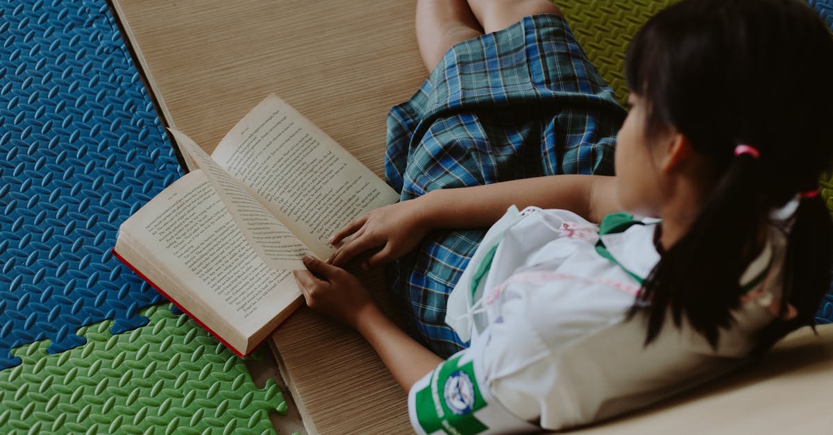 Do I need a visa to connect in Thailand on separately book tickets? - Girl in School Uniform Reading Book on Floor in Classroom Do I need a visa to connect in Thailand on separately book tickets? - Girl in School Uniform Reading Book on Floor in Classroom