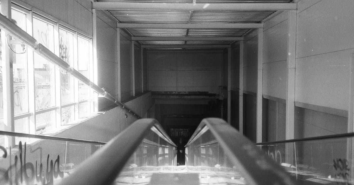 Do I need a visa to exit the airport during a layover in the Schengen area? [duplicate] - Grayscale Photo of a Tunnel
