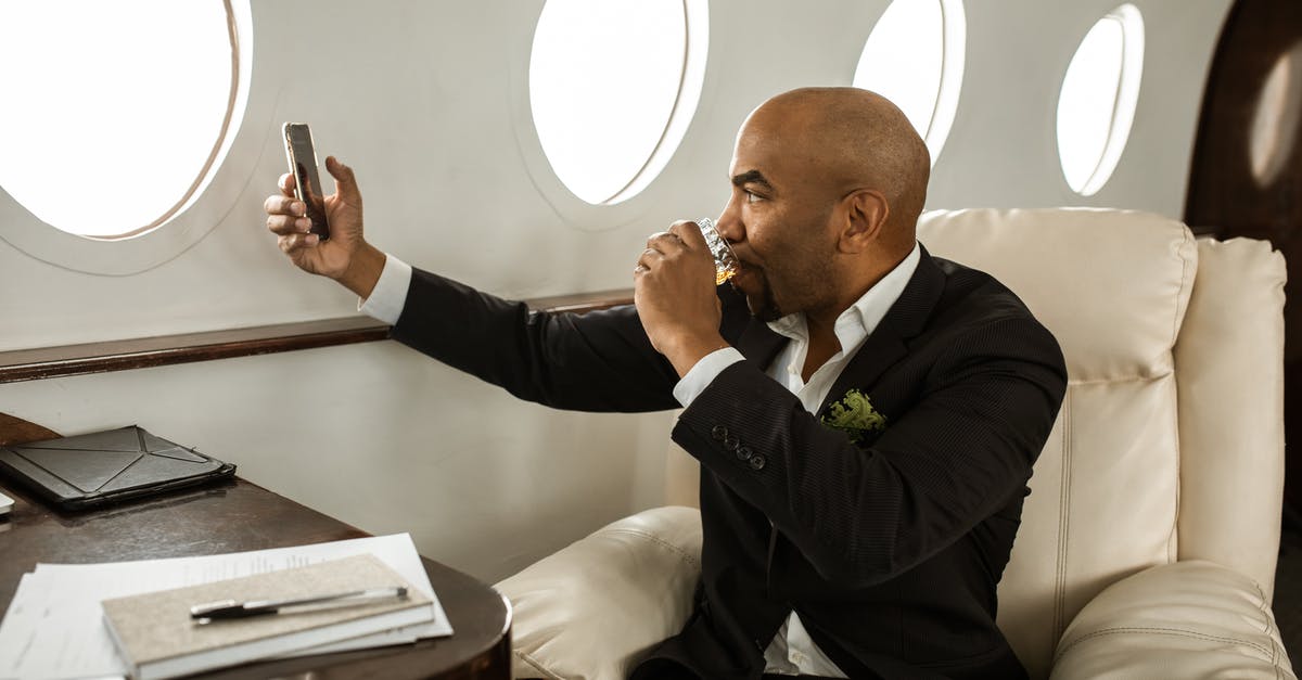 Do I need DATV to meet family at the Heathrow airport during my layover for a connecting flight? [duplicate] - Man in Black Suit Sitting on Chair