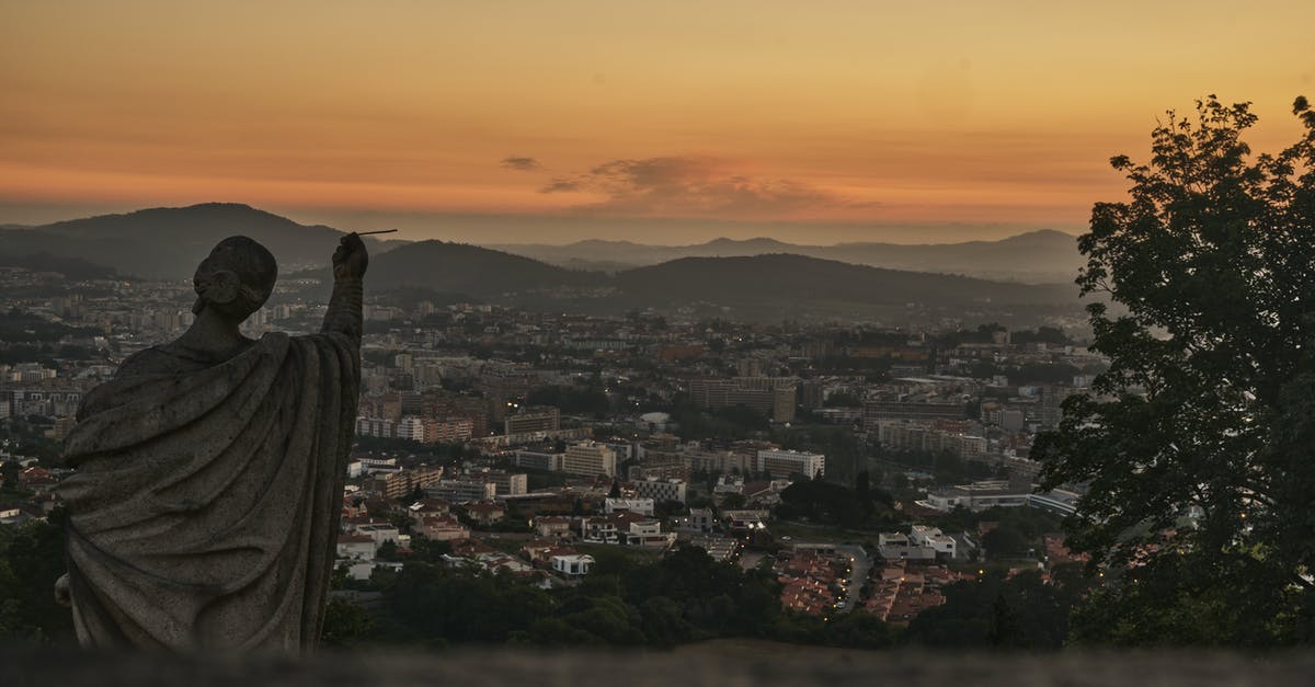 Do I need Schengen travel insurance to visit Portugal if covered by the NHS? - Lady Figure Statue Facing City Panorama Do I need Schengen travel insurance to visit Portugal if covered by the NHS? - Lady Figure Statue Facing City Panorama