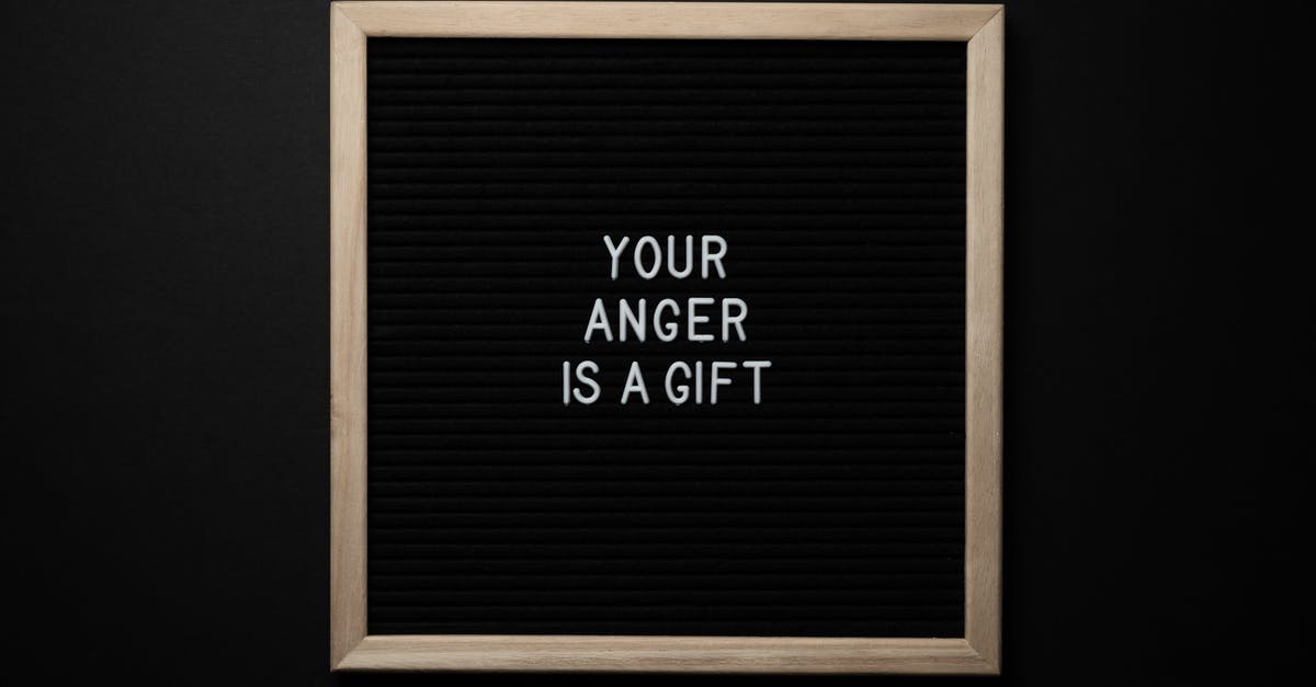 Do I need to change the wrong title in my ticket? [duplicate] - From above wooden frame with texture background and white caption on center on black background