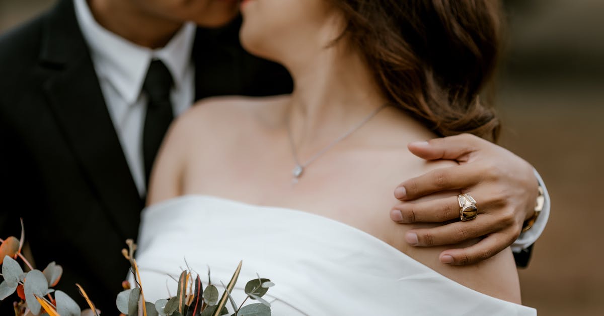 Do I need to declare engagement ring bought in UK when flying on holiday to US? - Crop married couple embracing in park Do I need to declare engagement ring bought in UK when flying on holiday to US? - Crop married couple embracing in park