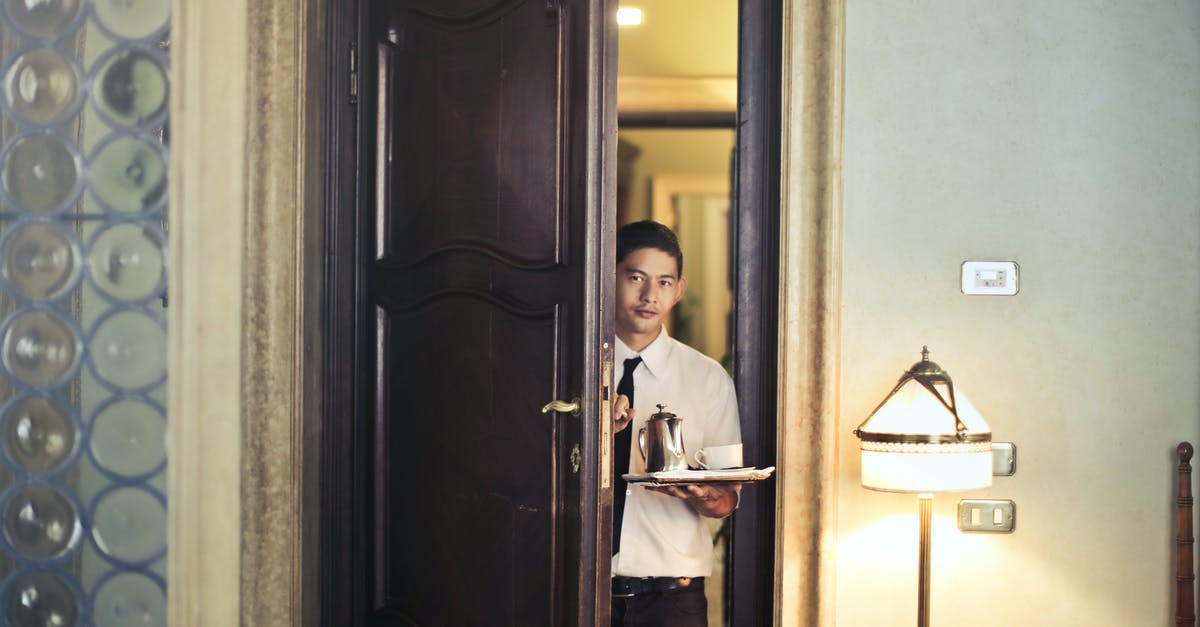Do I need to enter USA every year in order to keep my B1/B2 visa valid? - Young ethnic male room service waiter carrying tray with coffee pot while entering hotel room with stylish vintage interior Do I need to enter USA every year in order to keep my B1/B2 visa valid? - Young ethnic male room service waiter carrying tray with coffee pot while entering hotel room with stylish vintage interior