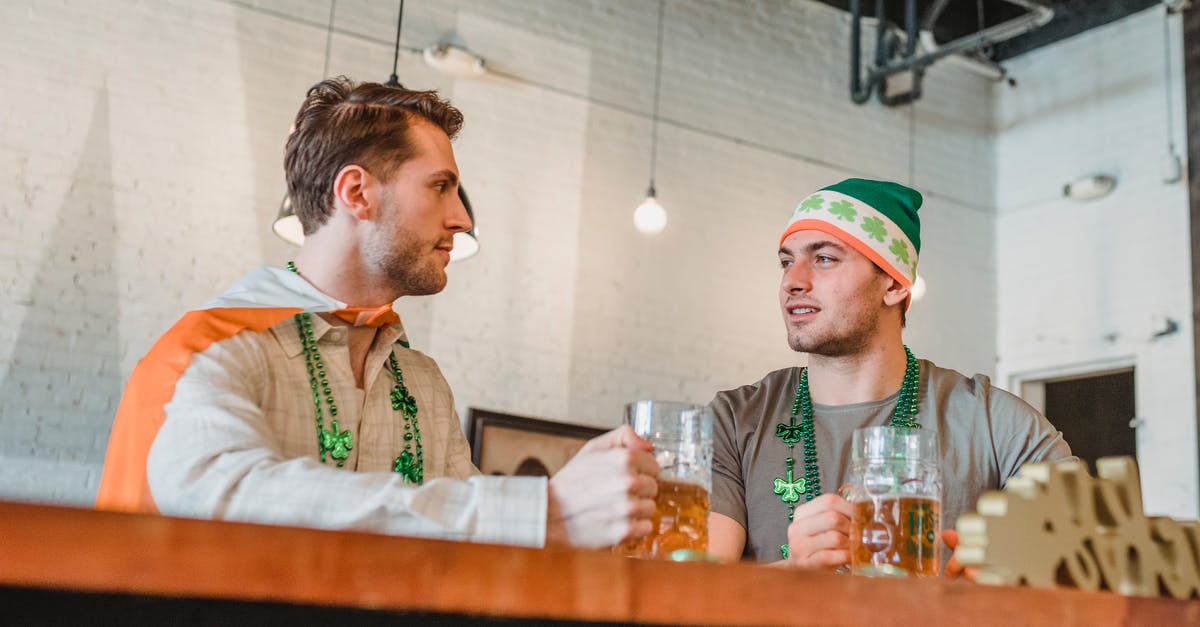 Do I need to notify Irish authorities when I leave on a working holiday? [closed] - Low Angle Shot of Men looking at each other 
