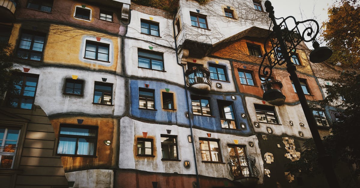 Do I need transit visa in Moscow while travelling from Guangzhou, CN to Vienna - VIE] [duplicate] - Facade of creative colorful apartment house in autumn city