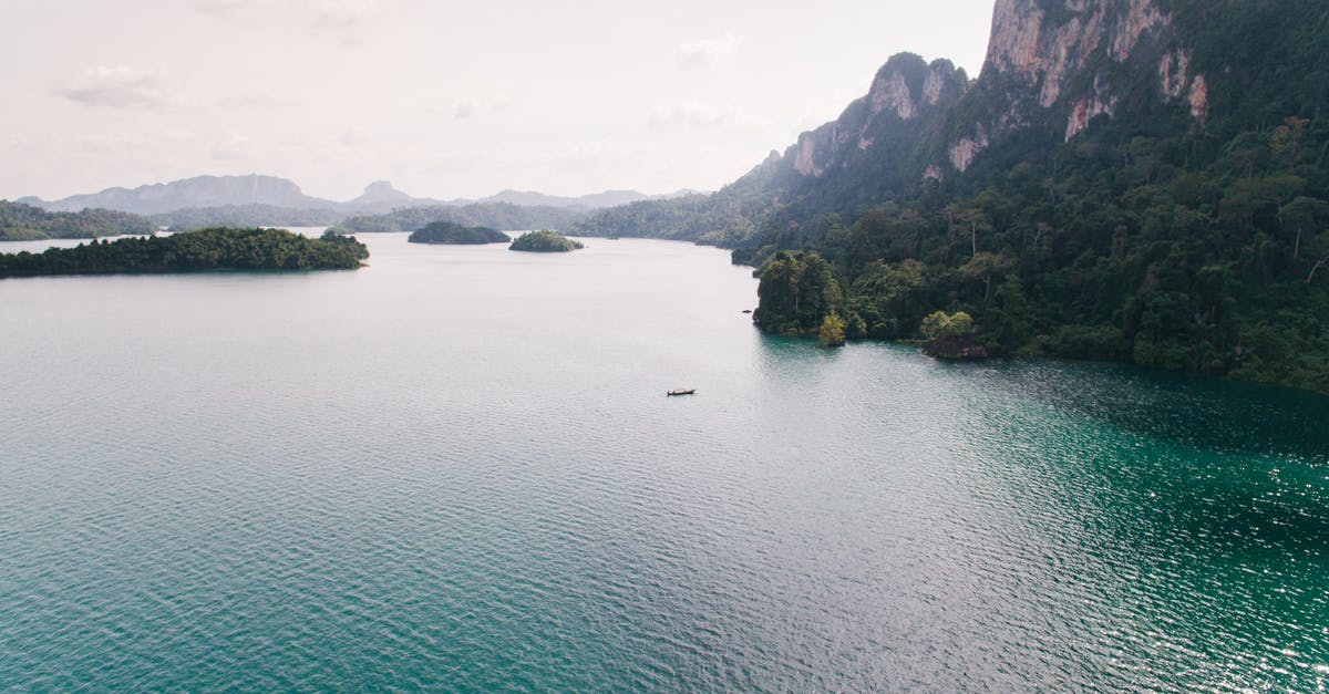 Do I need visas to travel from Pakistan to Cayman Islands via UK or Canada? [duplicate] - Drone Shots of Islands and Islets Above Water