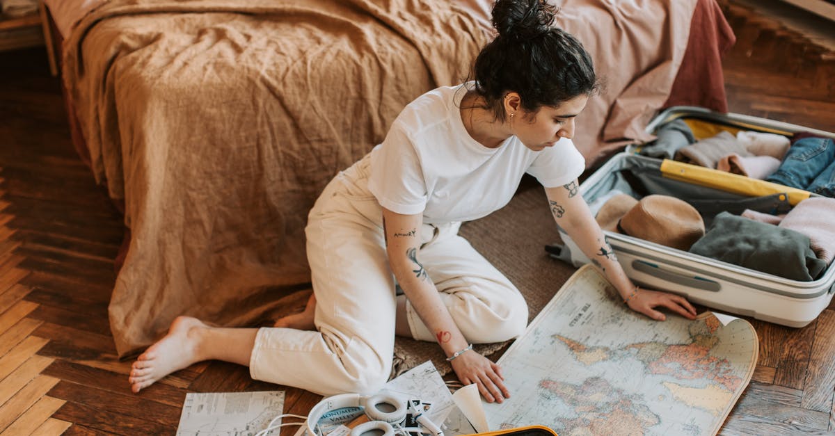 Do I "Need" a luggage lock in the US? - Man in White Shirt Writing on White Paper Do I "Need" a luggage lock in the US? - Man in White Shirt Writing on White Paper