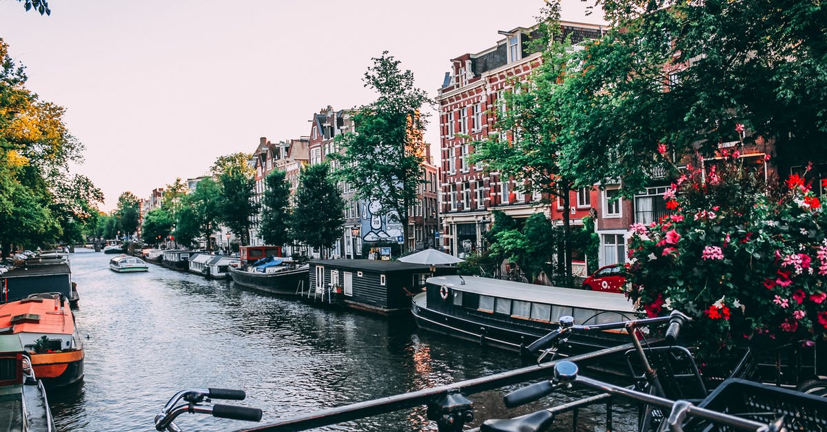 do I require Transit visa for Amsterdam since I am travelling from Delhi- Amsterdam- Havana and my layover time at Amsterdam is 1.45 hrs [duplicate] - Three Bicycle Upright Parked on Bridge