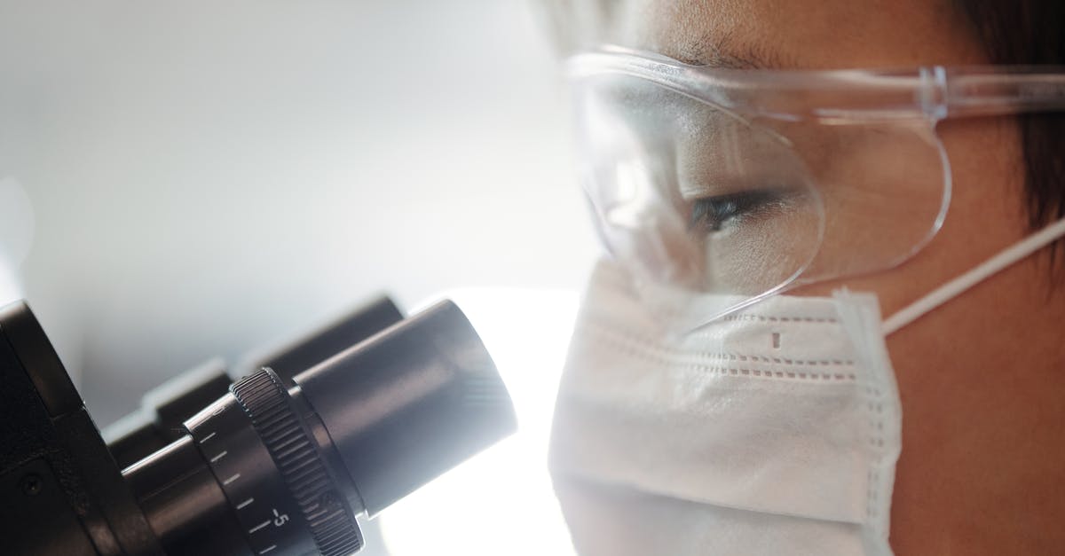 Do I still need a blood test for a Kurdistan residency permit? - Man Looking Through A Microscope Do I still need a blood test for a Kurdistan residency permit? - Man Looking Through A Microscope