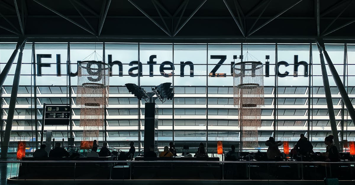 Do intra-Schengen flights into Zurich deplane into the departures concourse? - Silhouette of People Sitting in Airport Waiting Area Do intra-Schengen flights into Zurich deplane into the departures concourse? - Silhouette of People Sitting in Airport Waiting Area