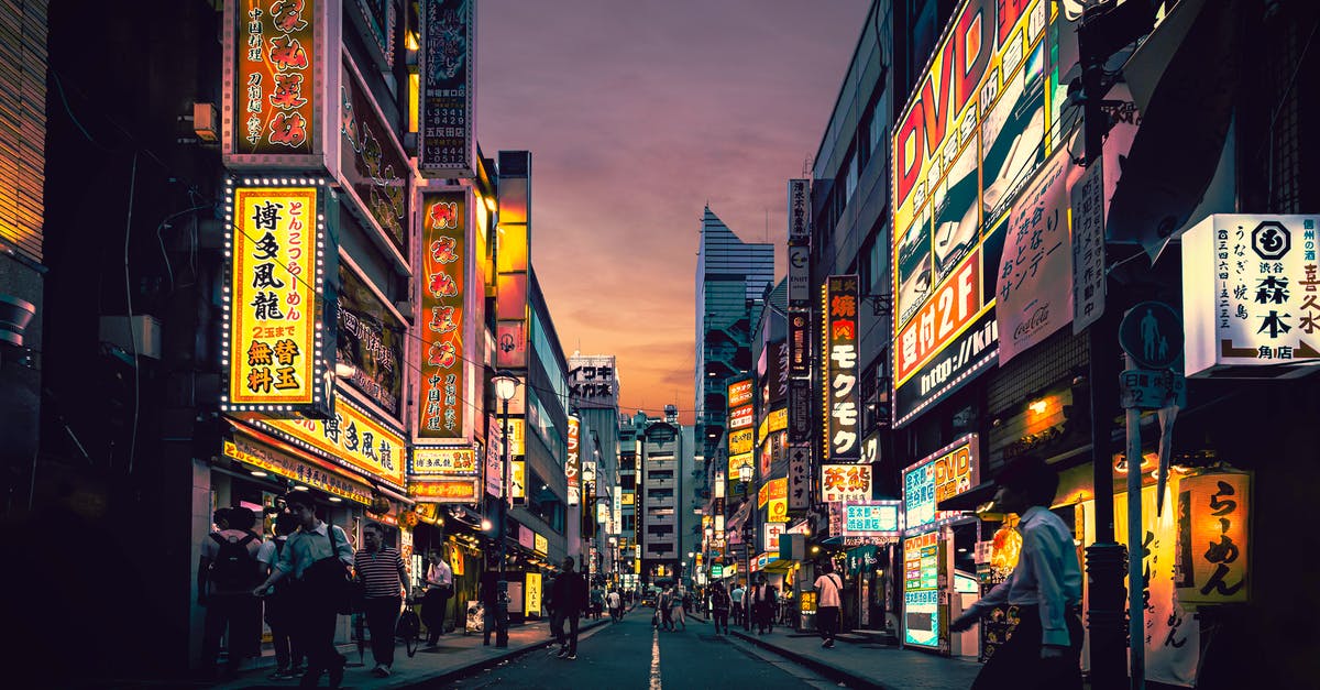 Do many Japanese people speak Korean? - People Walking on Street Near Buildings Do many Japanese people speak Korean? - People Walking on Street Near Buildings