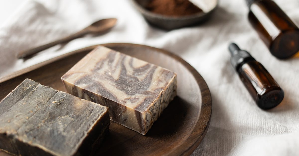 Do skincare sheet masks fall in the liquids category for carry ons? - Handmade brown soap on timber board near aromatic oil
