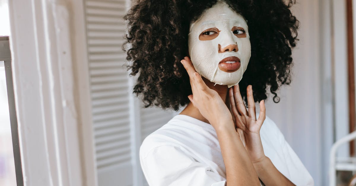 Do skincare sheet masks fall in the liquids category for carry ons? - Young woman doing cosmetic procedure at home
