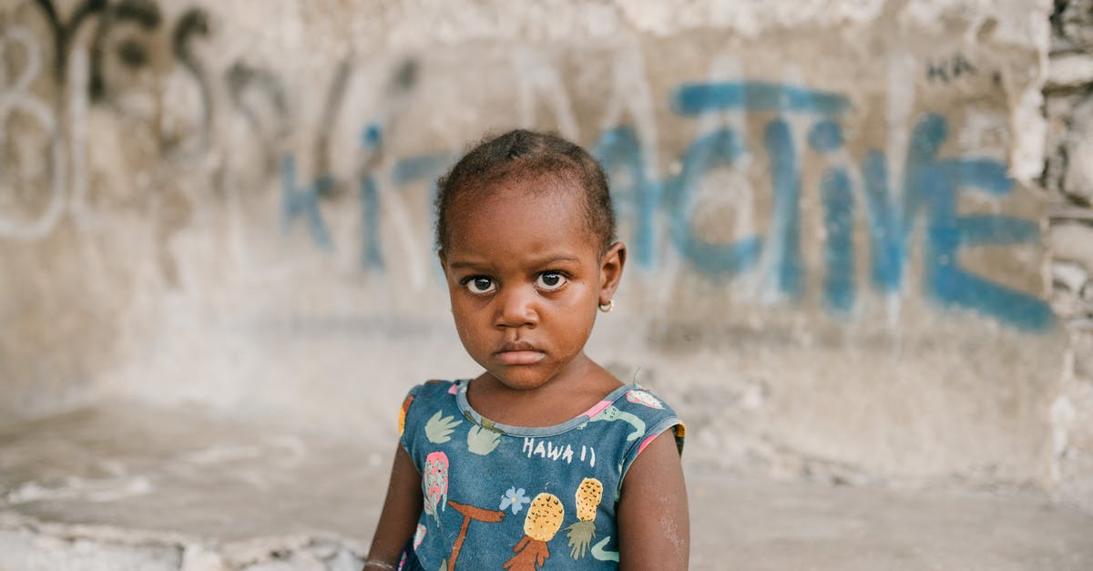 Do South African citizens need a visa to enter Dubai? - Frowning African American girl near weathered concrete building with vandal graffiti and broken wall in poor district Do South African citizens need a visa to enter Dubai? - Frowning African American girl near weathered concrete building with vandal graffiti and broken wall in poor district