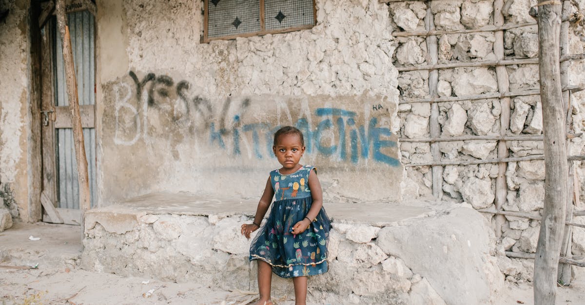 Do South African citizens need a visa to enter Dubai? - Little black girl sitting on rough stone border in ghetto Do South African citizens need a visa to enter Dubai? - Little black girl sitting on rough stone border in ghetto