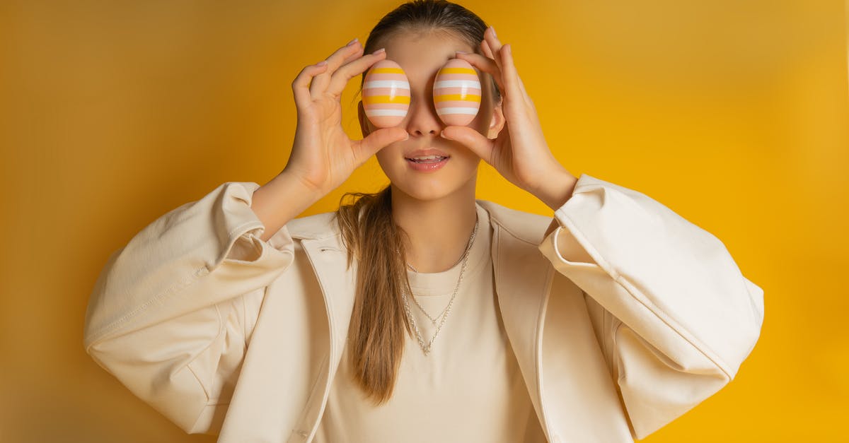 Do staple holes in front cover of the passport mean it's damaged? - Girl Holding Easter Eggs in Front of Eyes