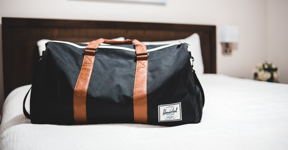 Do the maximum allowed dimensions for baggage include the handles? - Contemporary baggage bag with inscription on white bed cover in light hotel room Do the maximum allowed dimensions for baggage include the handles? - Contemporary baggage bag with inscription on white bed cover in light hotel room