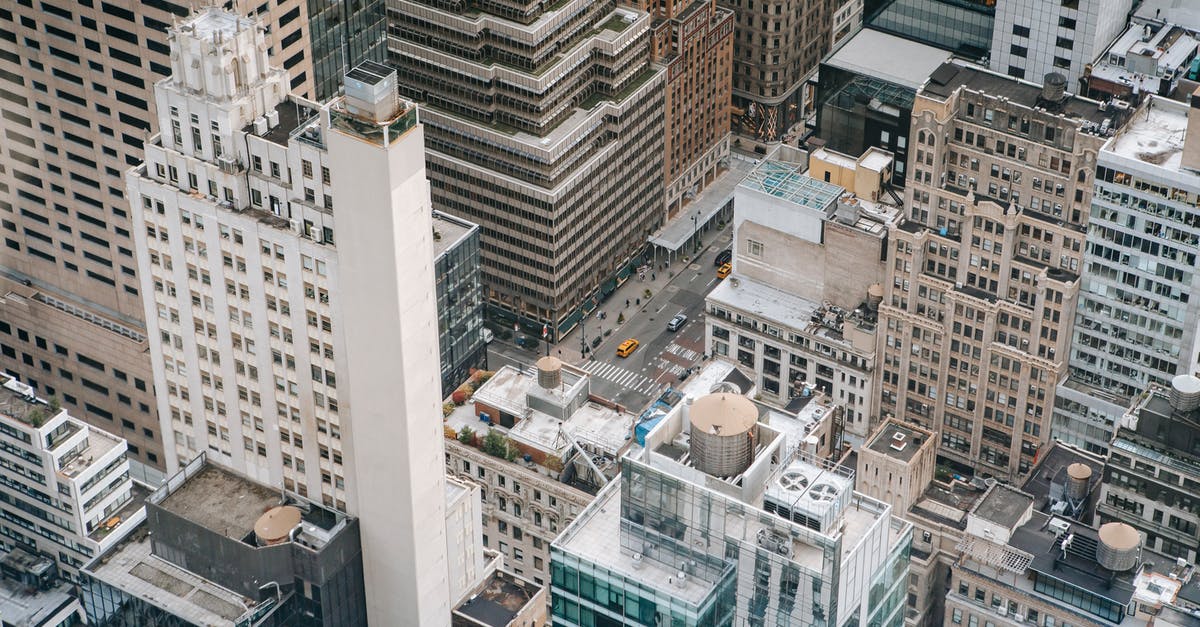 Do the road rules change from DC to NY in USA? - Traffic on road between modern building facades in city Do the road rules change from DC to NY in USA? - Traffic on road between modern building facades in city