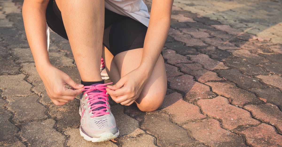 Do trains run to Beni Nsar Port in Morocco? - Woman Lacing Up Her Gray and Pink Nike Low-top Athletic Shoe Do trains run to Beni Nsar Port in Morocco? - Woman Lacing Up Her Gray and Pink Nike Low-top Athletic Shoe
