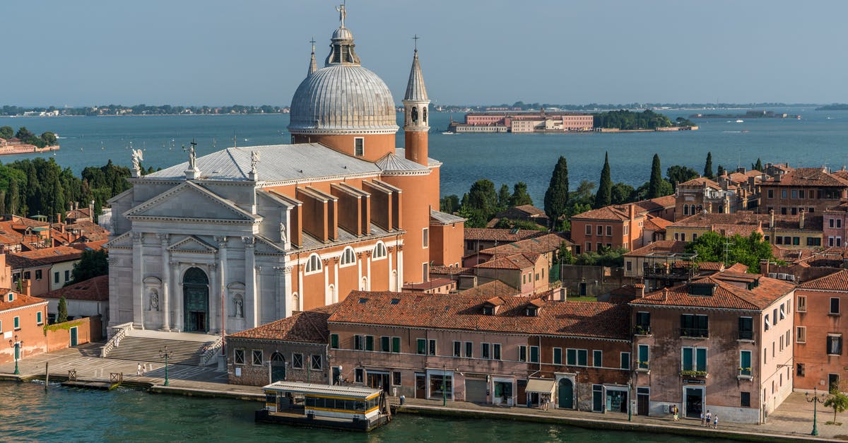Do US citizens need any visas while on a cruise in the Mediterranean? - White and Beige Structure Building and Cathedral Near Body of Water during Daytime