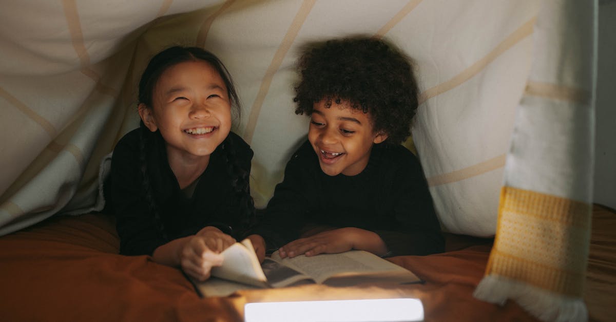 Do you have to book motels in advance on a road-trip? - Girl And Boy Having Fun While Reading A Book