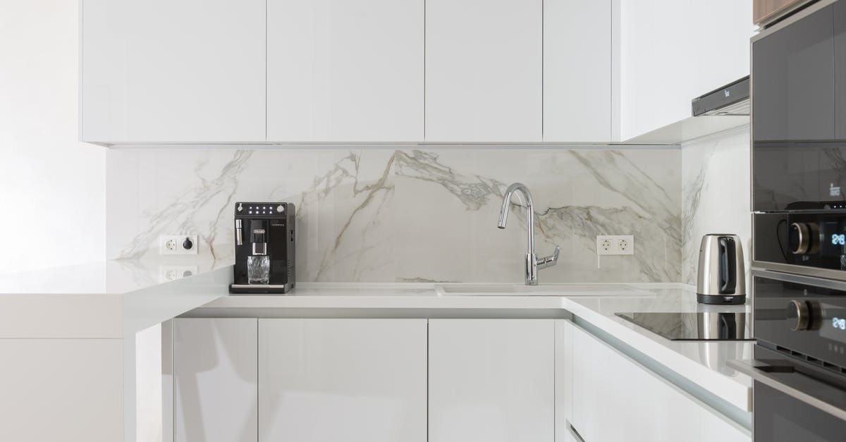 Do you have to leave Schengen zone to validate a new Schengen visa after marrying to an EU citizen? [closed] - Modern kitchen interior with furniture and appliances