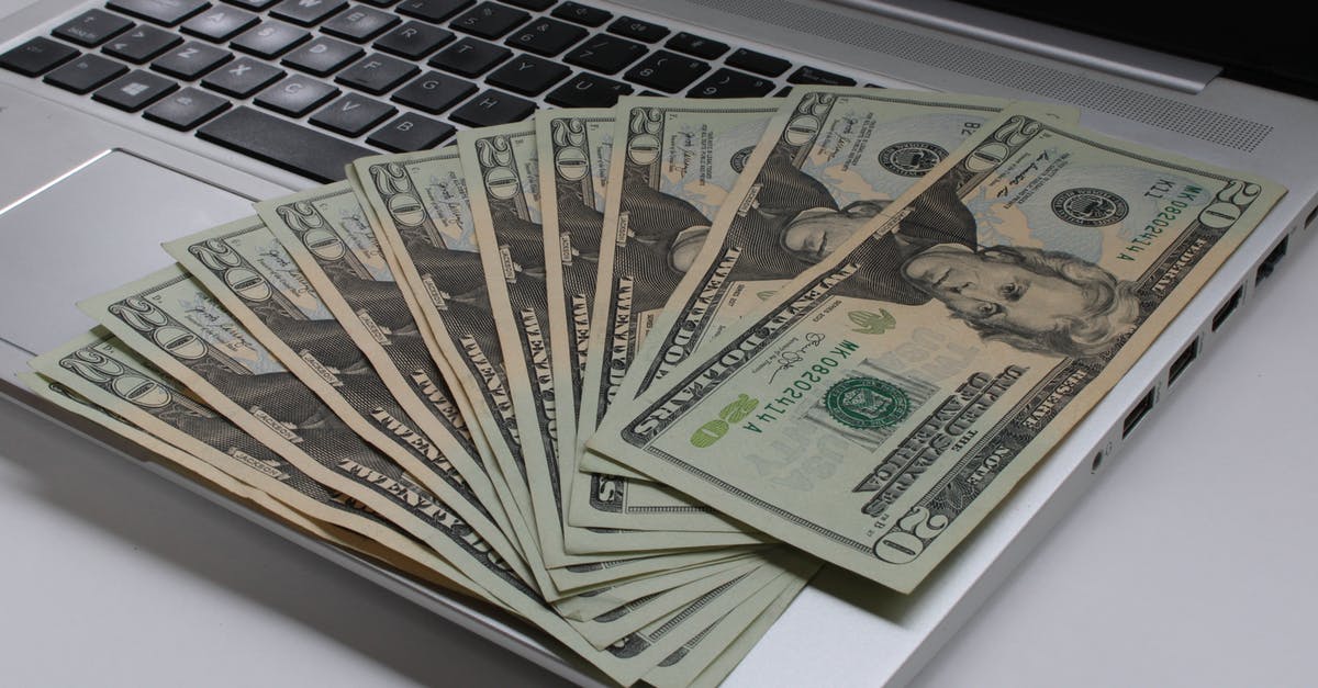 Do you have to pay immigration to leave Malaysia? - Dollars on laptop Do you have to pay immigration to leave Malaysia? - Dollars on laptop