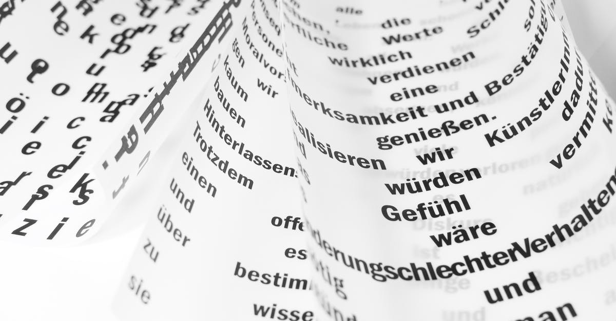 Document stamping - From above of white sheets of paper with curled edges and black written words placed on white background in light room