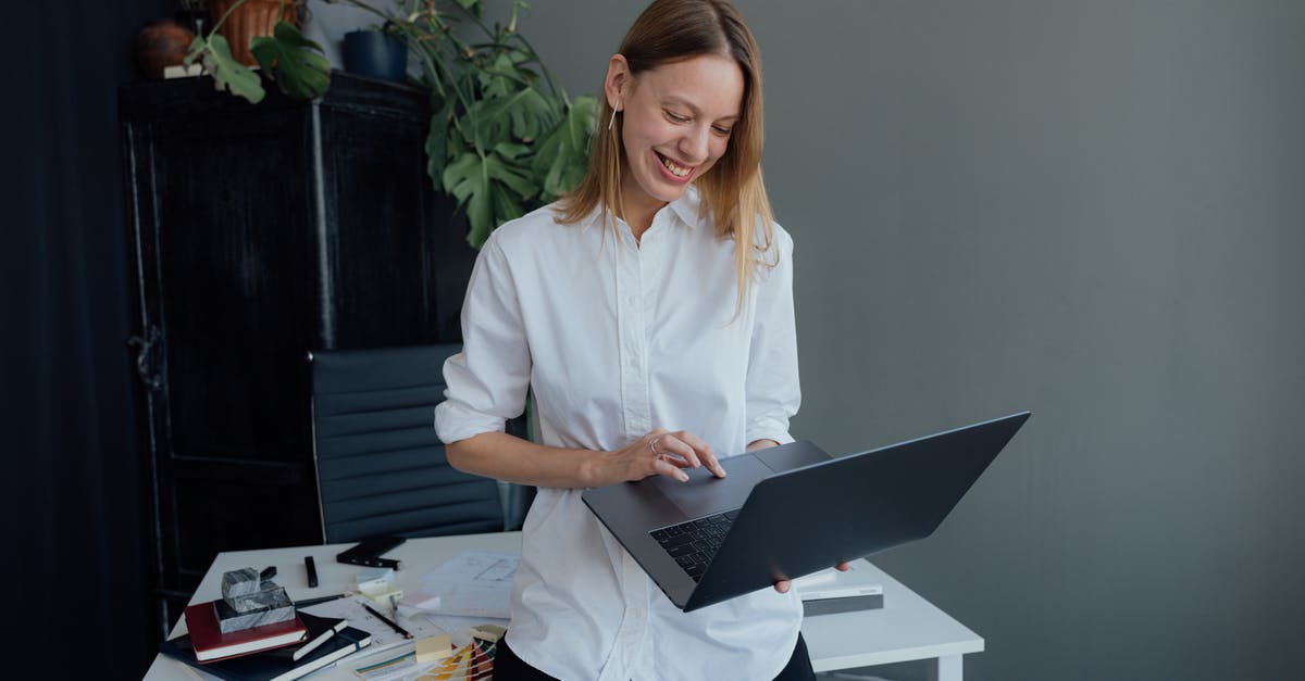 Documents to import a PC from Ukraine to the US for personal use [closed] - Smiling Woman Using a MacBook while Leaning on a Desk