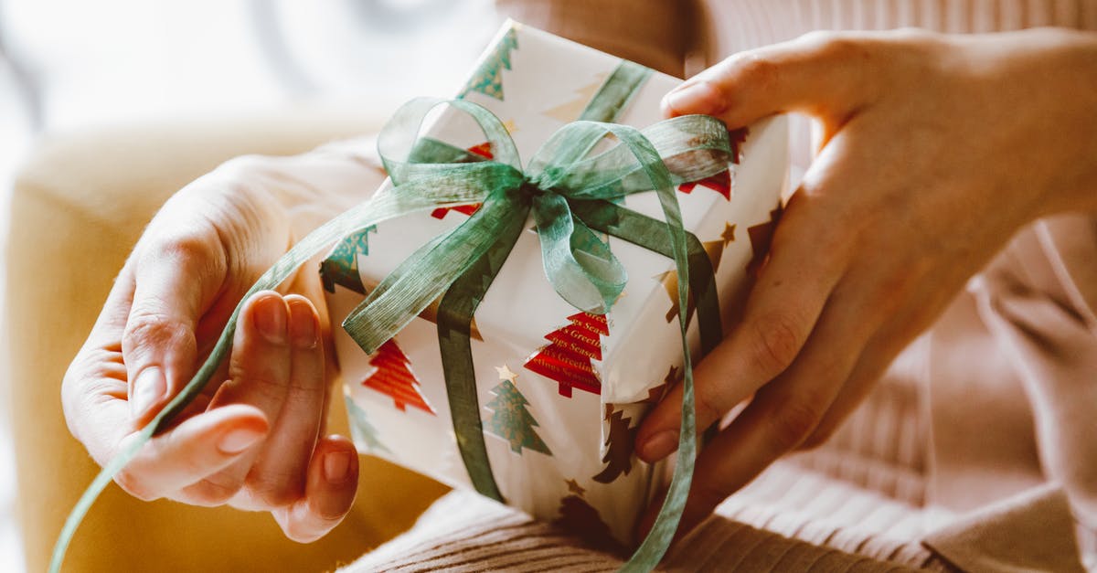 Does a minor need to be present to apply for a passport in Colombia? [closed] - Person Holding White and Green Gift Box